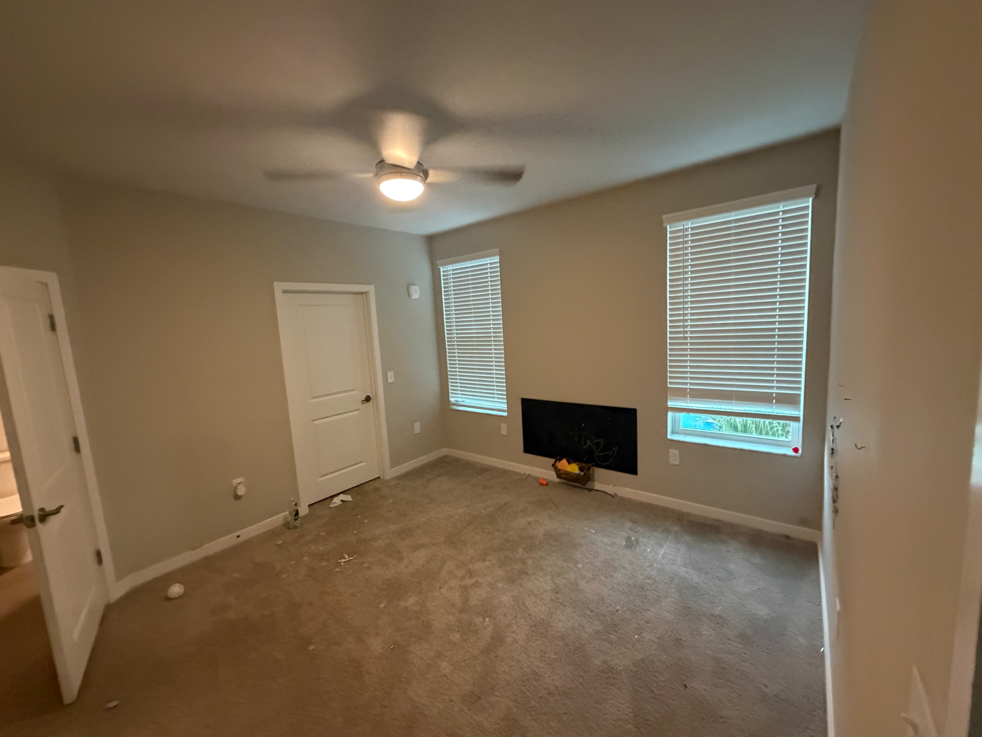 Same bedroom completely empty after the bed frame was removed